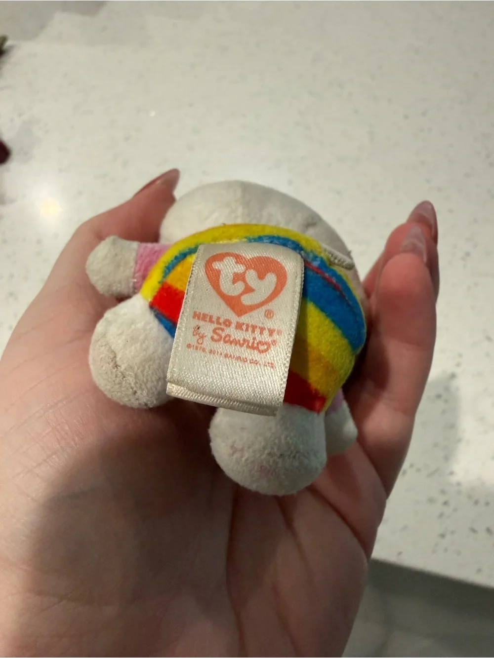 Hello Kitty Rainbow Plush Clip-On Keychain - Gray Body, Red Clip
